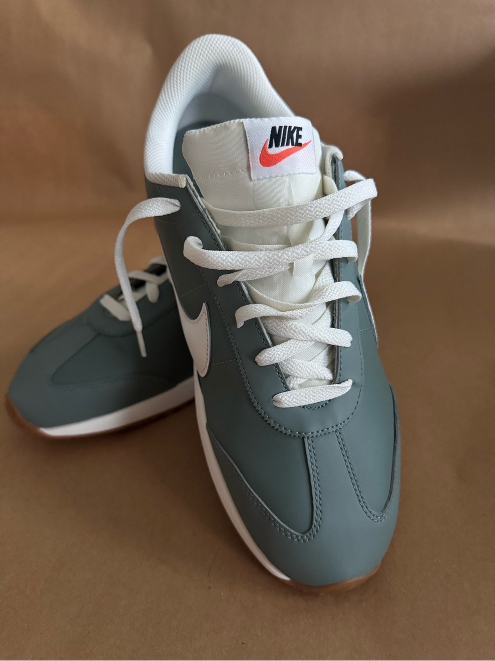 Nike Kids Teal and White Low-Top Sneakers with Orange Swoosh